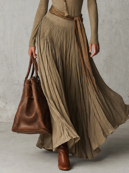 Júlia - Elegante abito maxi plissettato con collo alto, maniche lunghe e fiocco in vita