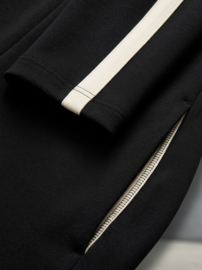 Monica | Completo tuta con righe nere a contrasto, top con zip e pantaloni a gamba larga con coulisse
