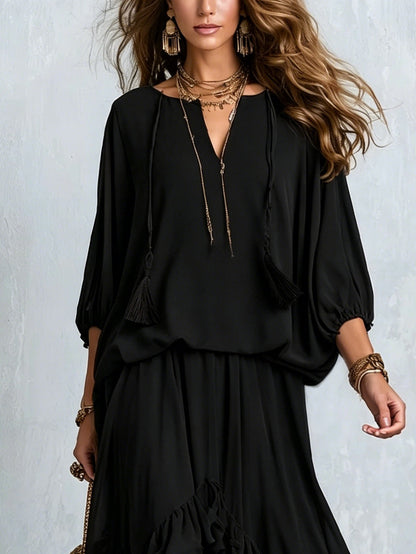 Elvira | Set composto da top nero in chiffon con scollo a V e frange, abbinato a gonna a balze a strati