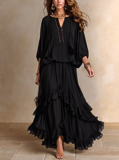 Elvira | Set composto da top nero in chiffon con scollo a V e frange, abbinato a gonna a balze a strati