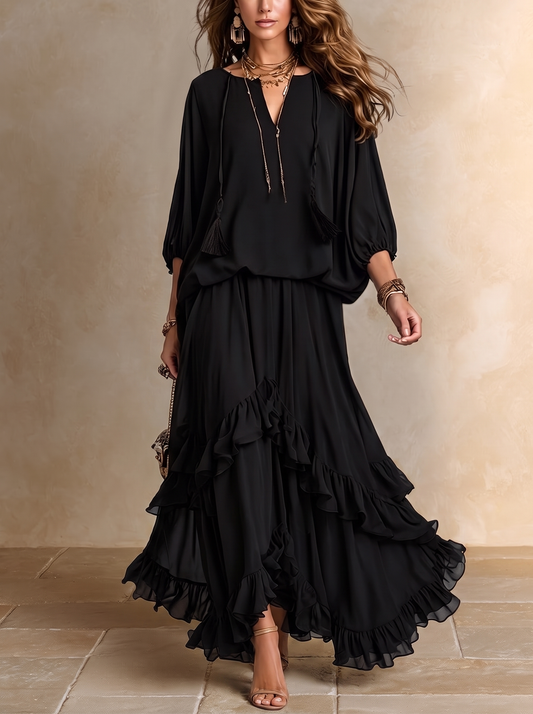 Elvira | Set composto da top nero in chiffon con scollo a V e frange, abbinato a gonna a balze a strati